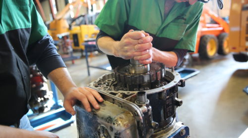 Student working on an automotive engine