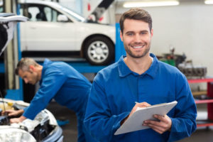 smiling mechanics attending trade schools